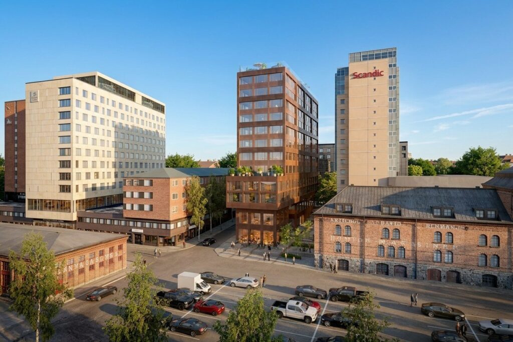 Flera höghus vid kajen i Umeå en solig dag